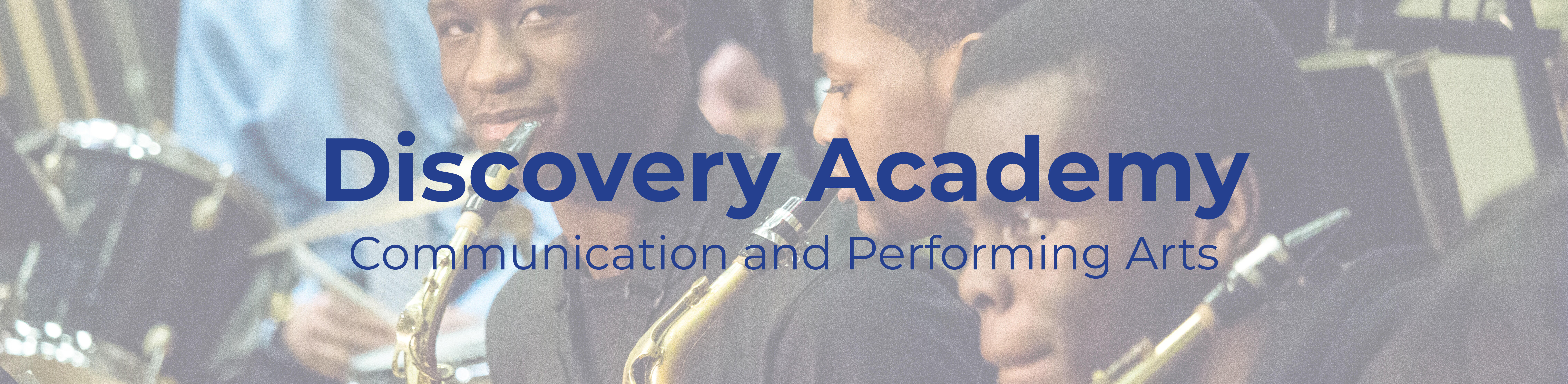 Text that reads "Discovery Academy" overlaid on a picture of a students playing instruments
