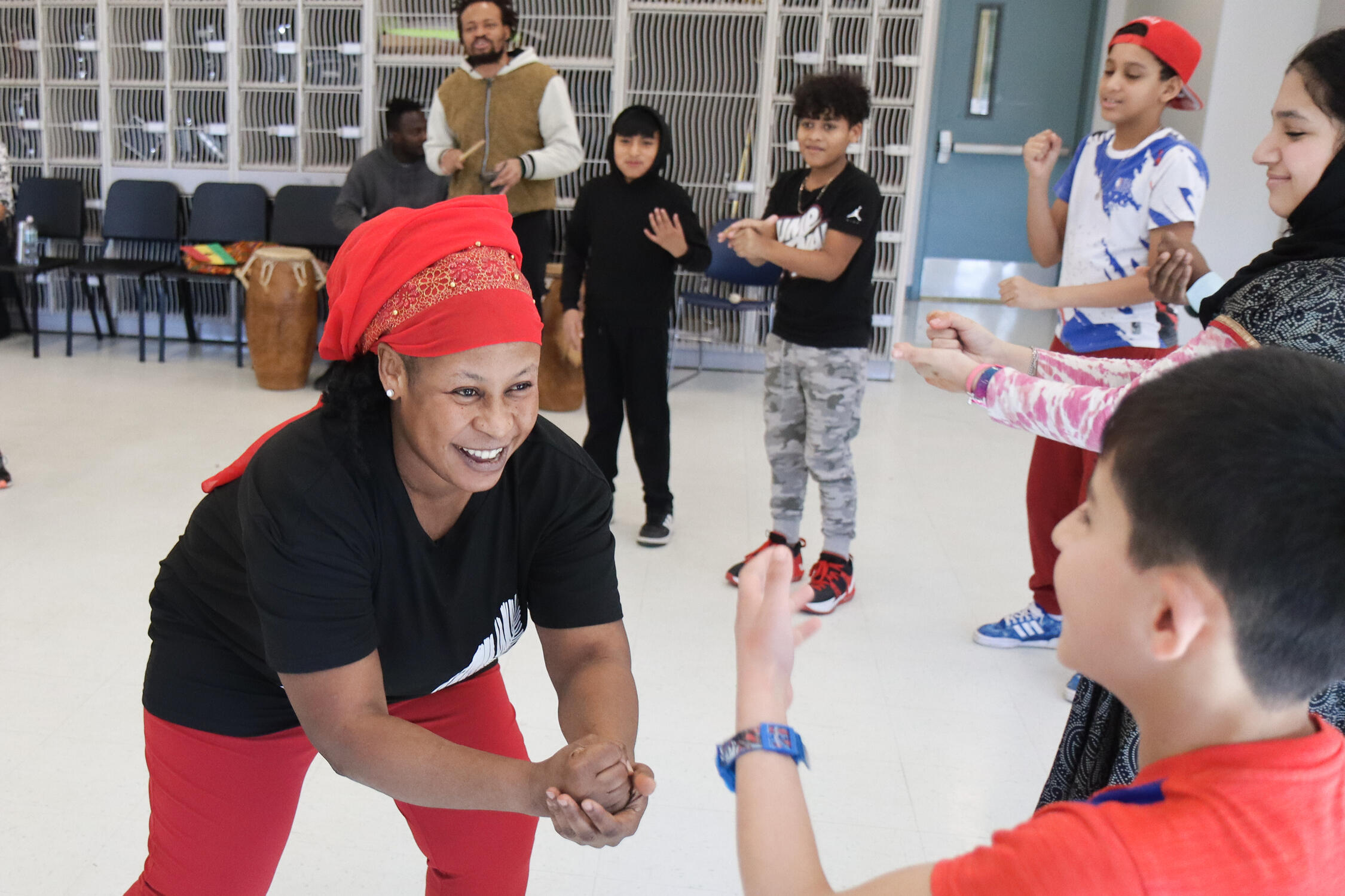 Community member and students engaged in a dance workshop