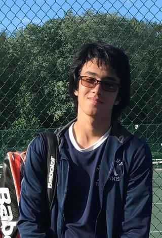 Masami Surisawa standing on the tennis court