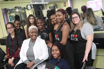 Cosmetology teacher LaQuita Love with her students