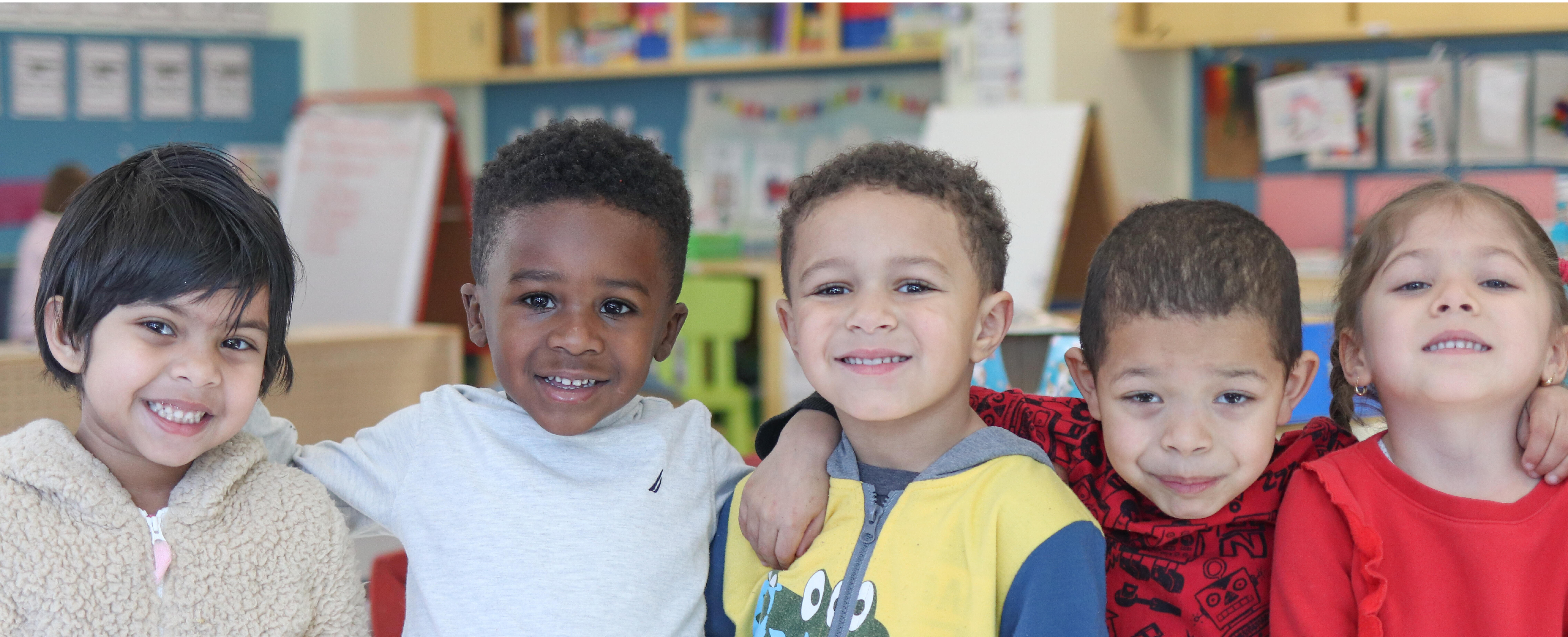 Pre-K students smiling for a picture