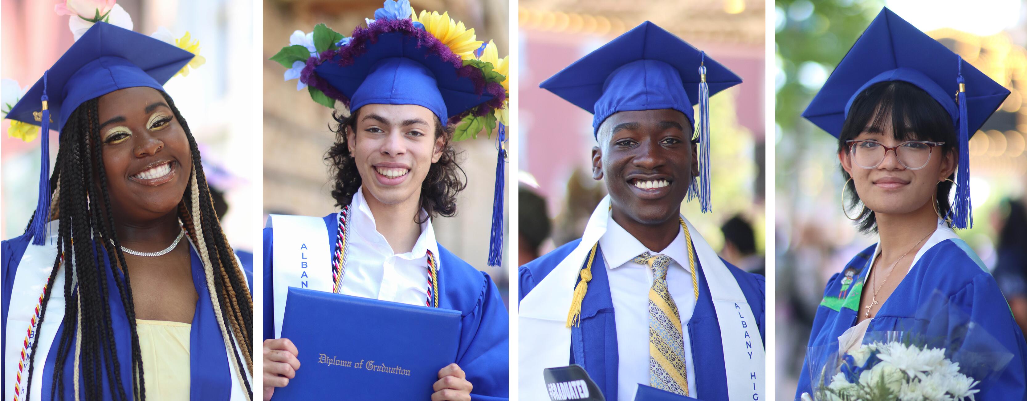 Graduates smiling and holding their diplomas